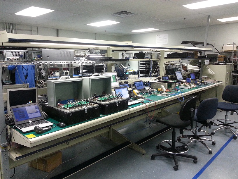 OEG's assembly and test bench, populated with custom controller boards under development